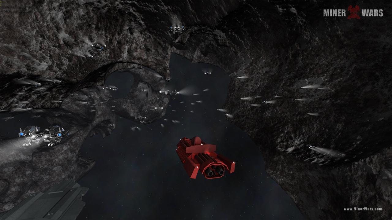 (pic showing a large group of miners in a player-tunneled asteroid cave)